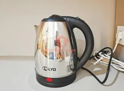 a black and white tea kettle on a counter at Newly Lavaya Resort 1BR with pool in Nusa Dua