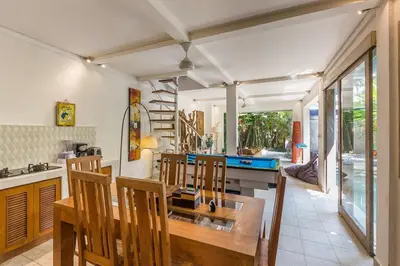 a kitchen and dining room with a table and chairs at Villa emma, 2 bed with pool table & private pool in Seminyak