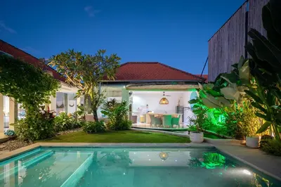 a house with a swimming pool in the yard at Villa 888 Eat Shop Play - 3BR Private Pool Oberoi in Seminyak