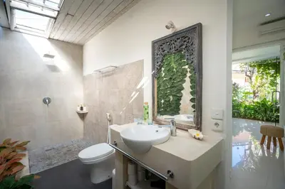 a bathroom with a sink and a toilet at Villa 888 Eat Shop Play - 3BR Private Pool Oberoi in Seminyak