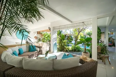 a living room with a couch and a table at Villa 888 Eat Shop Play - 3BR Private Pool Oberoi in Seminyak