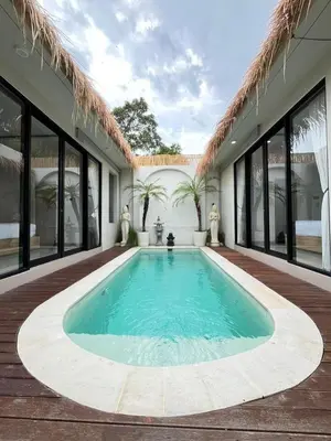 a swimming pool in the middle of a house at Ametys 1 Villa - Cozy 2BR Villa with Private Pool & Prime Seminyak in Seminyak