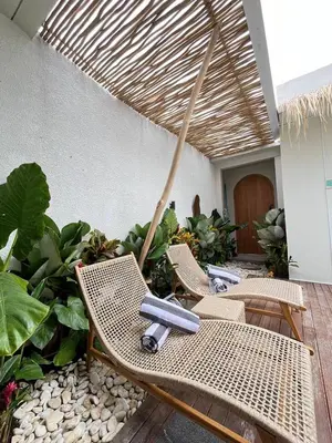 a group of chairs sitting on a patio at Ametys 1 Villa - Cozy 2BR Villa with Private Pool & Prime Seminyak in Seminyak