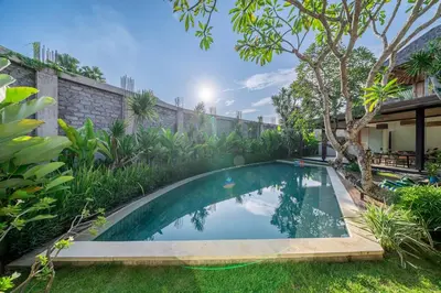 an image of a swimming pool in a garden at Lux Ayuni Big Modern 2BR Designer Villa Berawa in Canggu