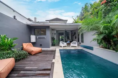 a swimming pool in the backyard of a house at Villa 111 - Romantic 1BR Villa in Batu Belig in Seminyak