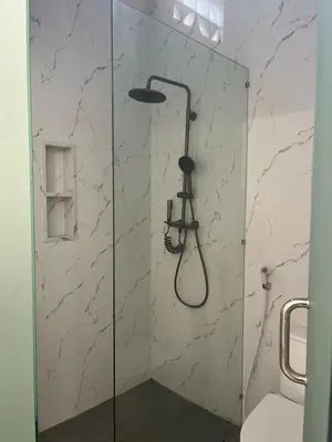 a shower with a glass door in a bathroom at Mediterranean Villa Sanur Beach in Sanur
