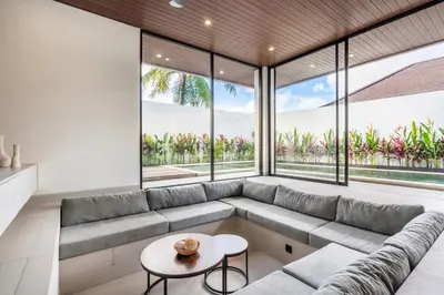 a living room with a couch and a table at New Villa 3BR Umalas Pool Near Seminyak and Canggu in Canggu
