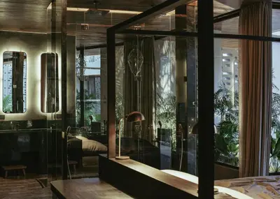a bedroom with a large glass wall at The Turiya - Redefining luxury in Canggu in Canggu
