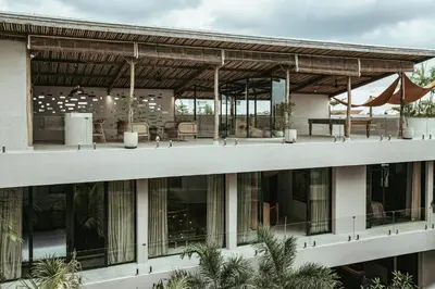 an external view of a building with a patio at The Turiya - Redefining luxury in Canggu in Canggu