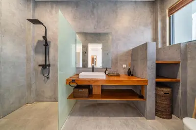 a bathroom with a sink and a mirror at Lindt - 3BR Villa with Private Pool and Ricefield View in Canggu