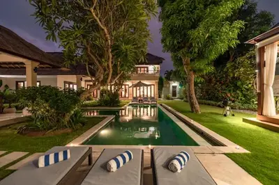 a house with a swimming pool in the yard at Villas Seminyak in Seminyak