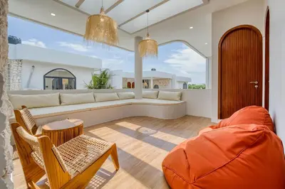 a living room with a couch and a table and chairs at Villa Tébu 3 BR Brand New Villa in Umalas in Kerobokan