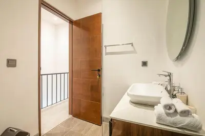 a bathroom with a sink and a shower at Enchanting 5BR Canggu Villa Moments to Sea in Canggu