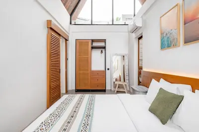 a bedroom with a white bed and a skylight at 2BR Villa in Canggu, Villa Sejiwa 3 in Canggu