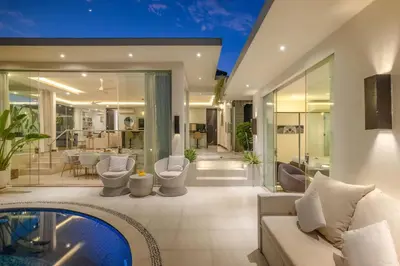 a living room with a pool in a house at Villa Mattina, Umalas in Canggu