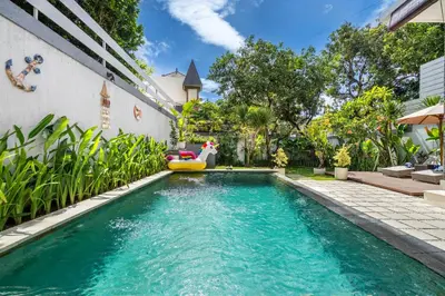 a swimming pool in the backyard of a house at Villa Avaluna by JB Villas in Seminyak