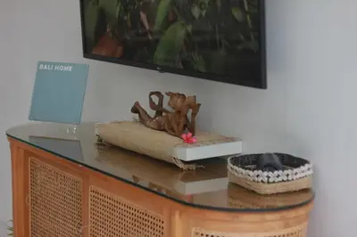 a glass table with a statue on top of it at Villa Marabia - Charming Quiet 3BR in Seminyak in Seminyak