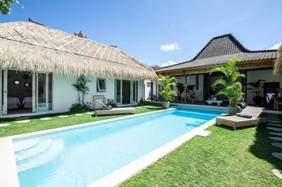 a swimming pool in front of a villa at New 5 bedroom Villa close to Seminyak eat street in Seminyak