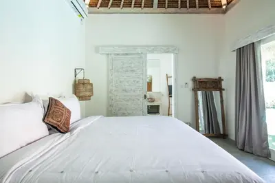 a bedroom with a large white bed in a room at New 5 bedroom Villa close to Seminyak eat street in Seminyak