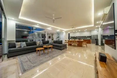 a living room with a couch and a table at Villa Aquila in Seminyak