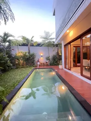 a swimming pool in the backyard of a house at Villa in South Kuta Dewi Amerta villa in Jimbaran