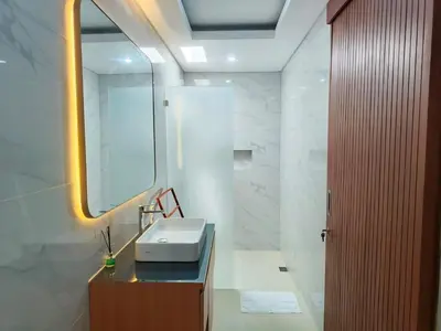 a bathroom with a sink and a mirror at RK4 Brand New 2Bedroom Villa Near Seminyak in Seminyak