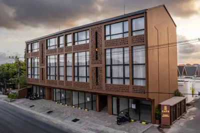 a building with windows on the side of a street at Gate 11 Mezzanine one in Denpasar