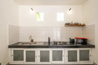 a kitchen with a sink and a counter top at Uma dharma villas 2 in Seminyak