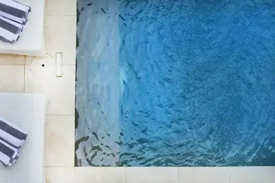 a blue painting on the wall of a bathroom at Villa Lisa - 3BR with pool Near Bali Mall Galleria in Kuta