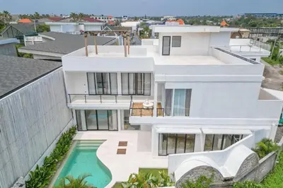 an aerial view of a white house with a swimming pool at Sunset room in a shared 4 bedroom villa in Canggu