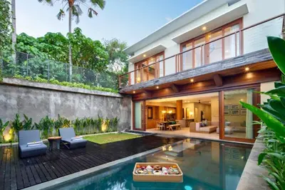 an exterior view of a house with a swimming pool at Annora Cozy 3 BR Private Pool Villa in Canggu
