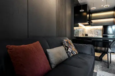 a living room with a couch and a piano at The Umalas Signature in Canggu