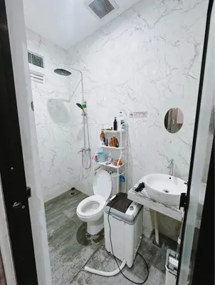 a bathroom with a toilet and a sink at Room Close to Seminyak - Cozy & Strategic Stay in Seminyak