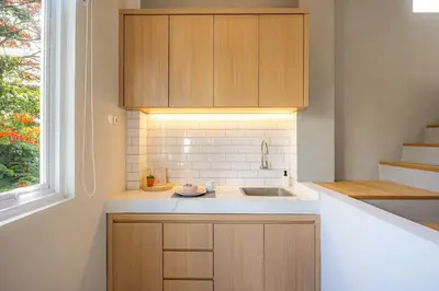 a kitchen with a sink and a window at Cove Nuansa Home in Jimbaran
