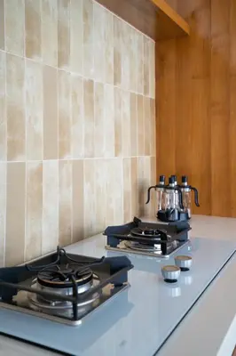 a stove top with pots and pans on a counter at Rosso Verde 2BR Villa near Seminyak in Seminyak