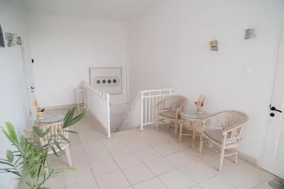 a dining room with a table and chairs at Adijaya Room 1 in Seminyak