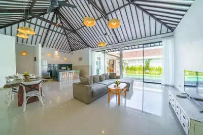 a living room with a couch and a table at Villa Kusuma 2 Seminyak in Seminyak