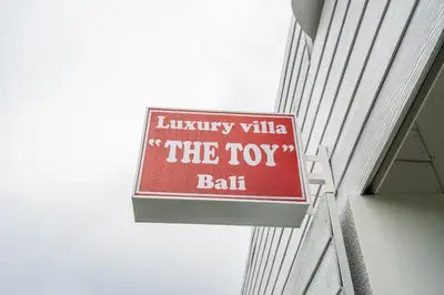 a sign for the toy ball on the side of a building at Luxury minimalist villa The Toy in Kerobokan