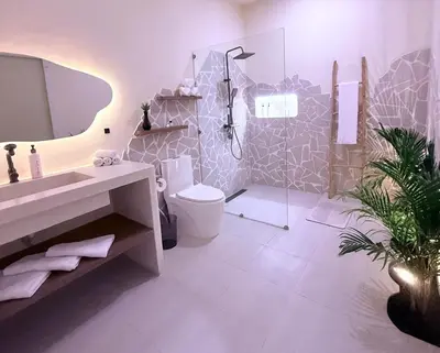 a bathroom with a sink and a toilet and a shower at Luxury Villa Grand Sanur in Sanur