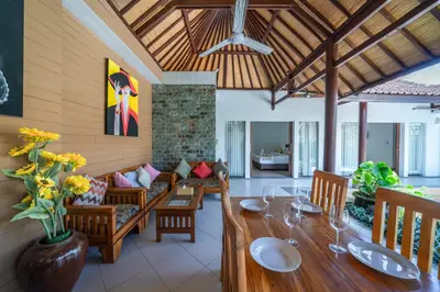 a living room with a table and a couch at Villa Dream Seminyak in Seminyak
