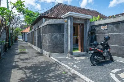 a motorcycle parked in front of a building at Villa Dream Seminyak in Seminyak