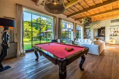 a living room with a pool table in it at Villa Yumi by BaliSuperHost in Canggu