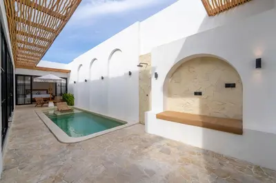 an external view of a pool in a house at Villa Bellora by Pertama Management in Seminyak