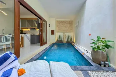a swimming pool in the middle of a living room at Ghayda Entire 3 BR Private Pool Villa in Seminyak