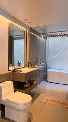 a bathroom with a toilet and a sink and a shower at Naiika villa in Seminyak