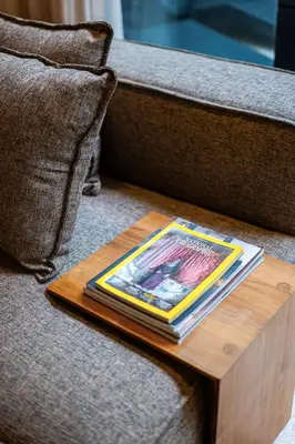 a book sitting on a table on a couch at Luxury Villa in Berawa Beach 3BR - Canggu in Canggu