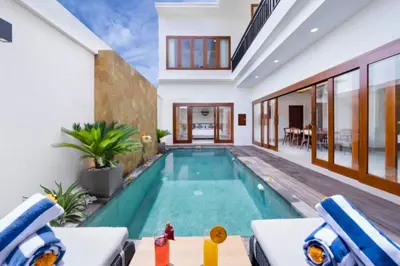 a swimming pool in the middle of a house at Zelene Elegant 3 BR Private Pool Villa in Seminyak