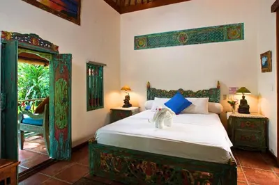 a bedroom with a bed with an elephant on it at Andina Spacious Garden 4 BR Private Pool Villa in Seminyak