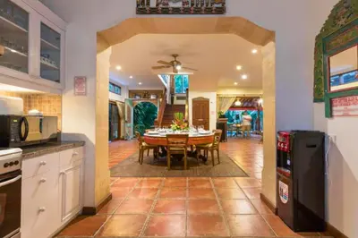 a kitchen and dining room with a table and chairs at Andina Spacious Garden 4 BR Private Pool Villa in Seminyak