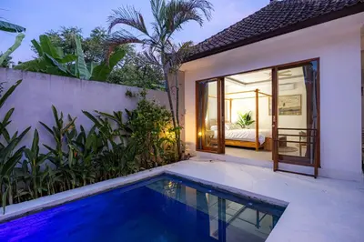a villa with a swimming pool and a bedroom at Ola - Private Villa - Umalas in Kerobokan